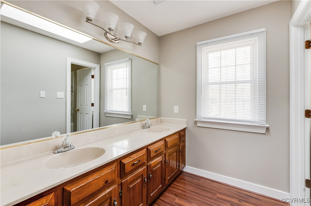 7400 Cannock Road Chesterfield, VA 23832 - Photo 25 of 36 a bathroom with a granite countertop sink and a mirror