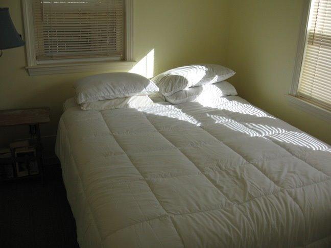 91 Glendon Road, Unit 93 Dennis Port, MA 02639 - Photo 4 of 5 a bedroom with a bed and a window