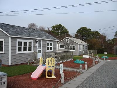 91 Glendon Road, Unit 93 Dennis Port, MA 02639 - Photo 5 of 5 a front view of a house with garden