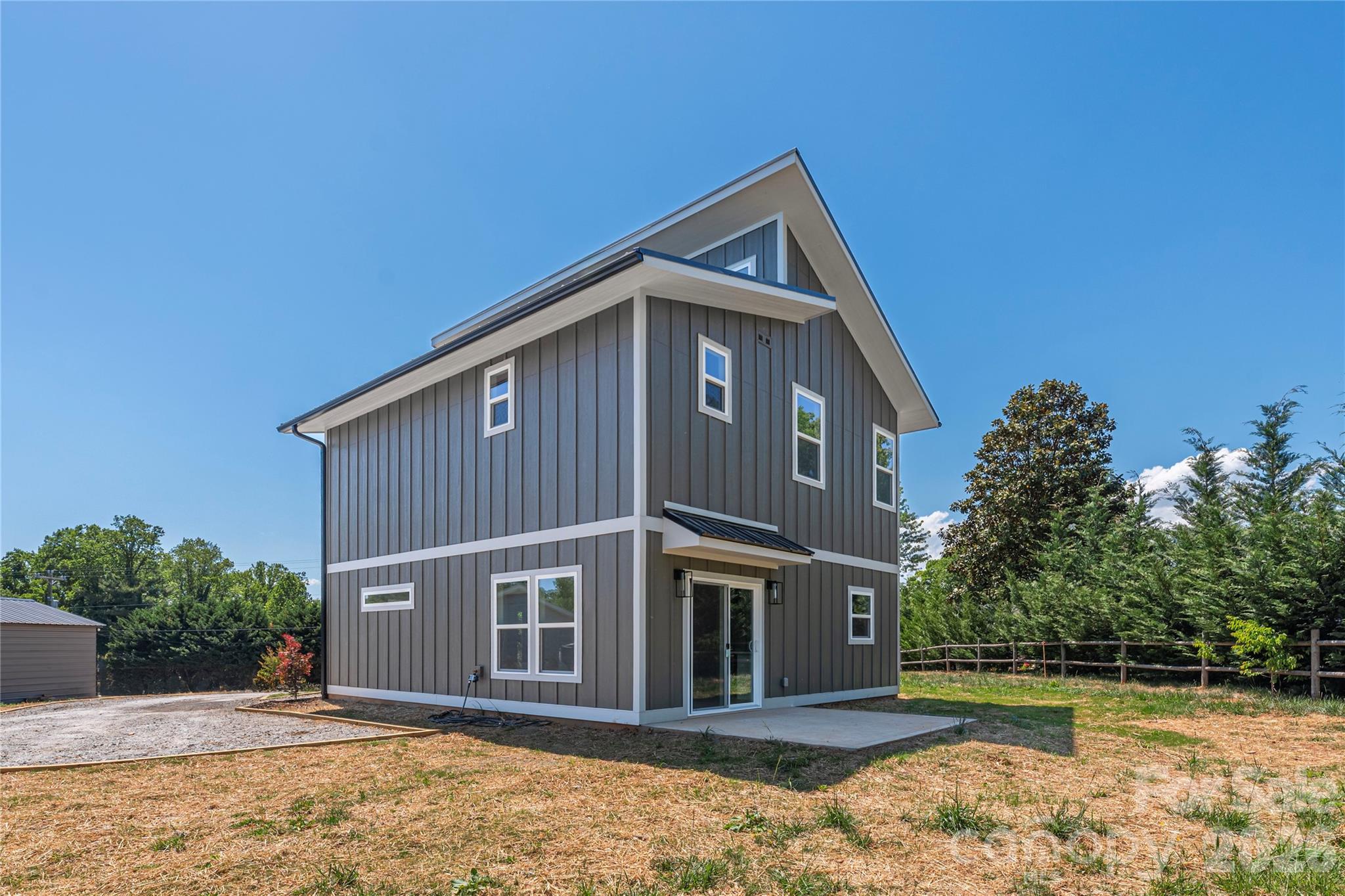 32 Oak Hill Road Candler, NC 28715 - Photo 24 of 29 a front view of a house with garden