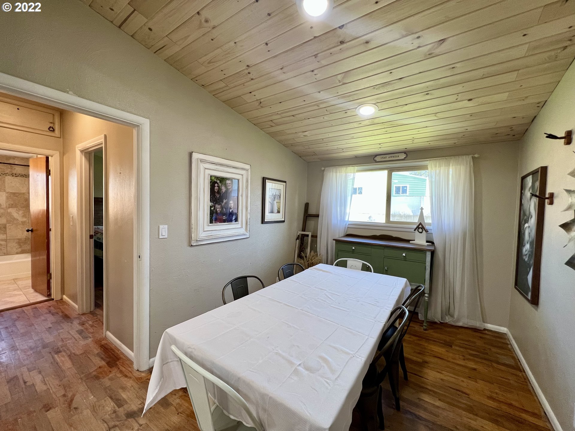 3026 Southwest Hailey Avenue Pendleton, OR 97801 - Photo 9 of 15 a room with a table chairs and wooden floor