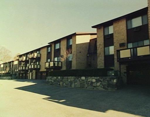 180 Glenbrook Road, Unit 36 Stamford, CT 06902 - Photo 1 of 1 a front view of building with yard