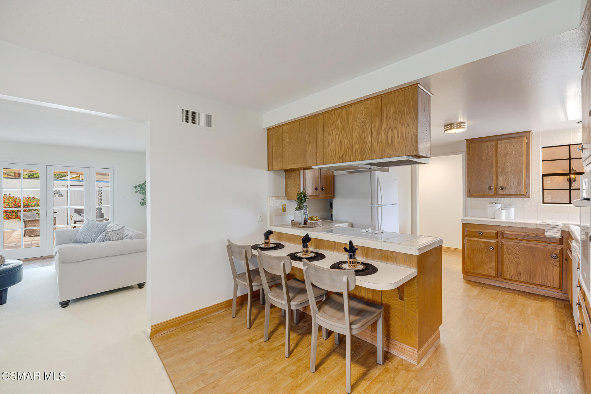 3491 Rivermore Street Camarillo, CA 93010 - Photo 15 of 49 a kitchen with a table and chairs in it