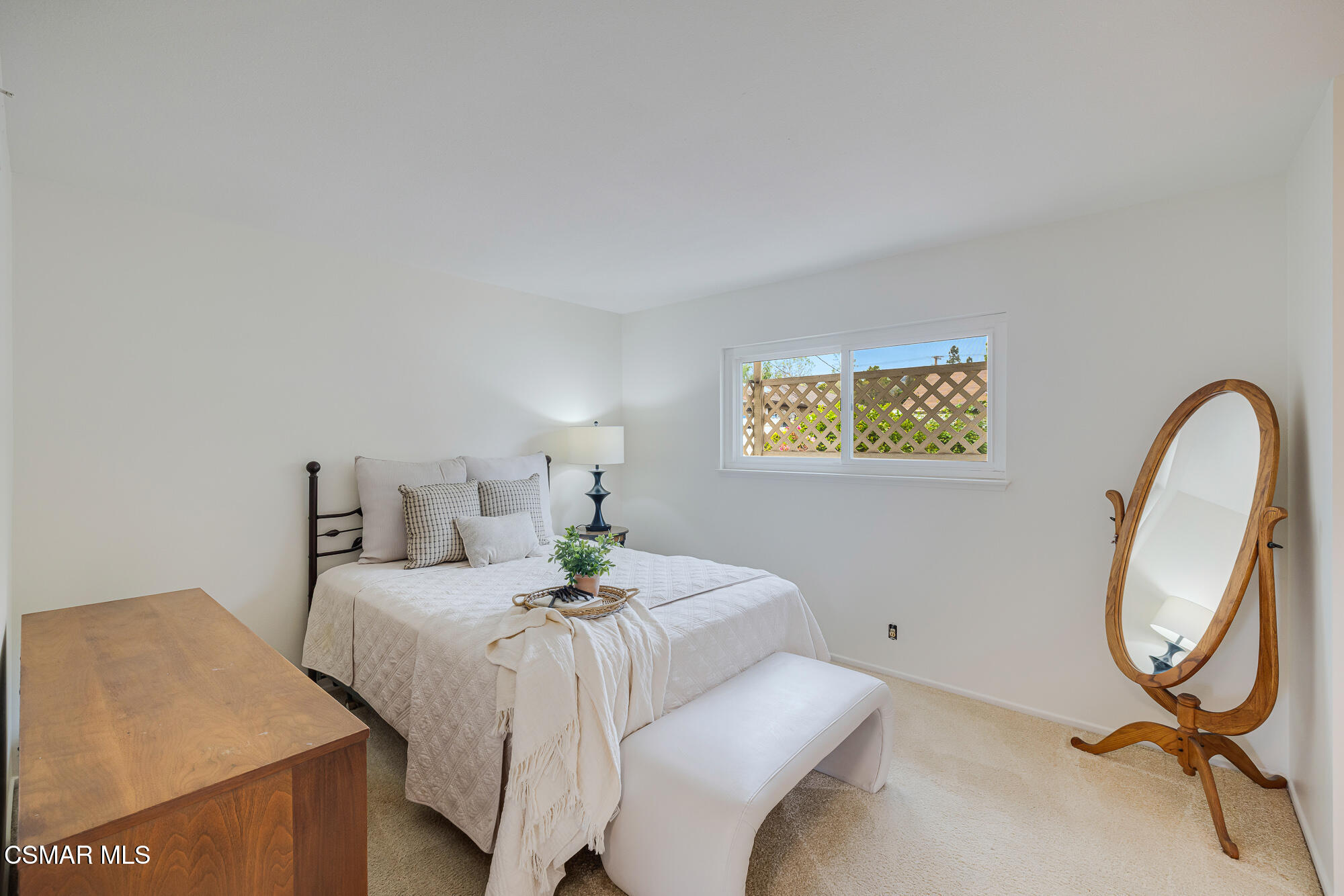 3491 Rivermore Street Camarillo, CA 93010 - Photo 31 of 49 a bedroom with a bed and a potted plant on the dresser