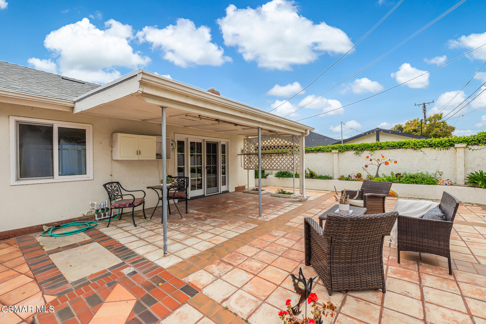 3491 Rivermore Street Camarillo, CA 93010 - Photo 35 of 49 a view of a patio with table and chairs and potted plants