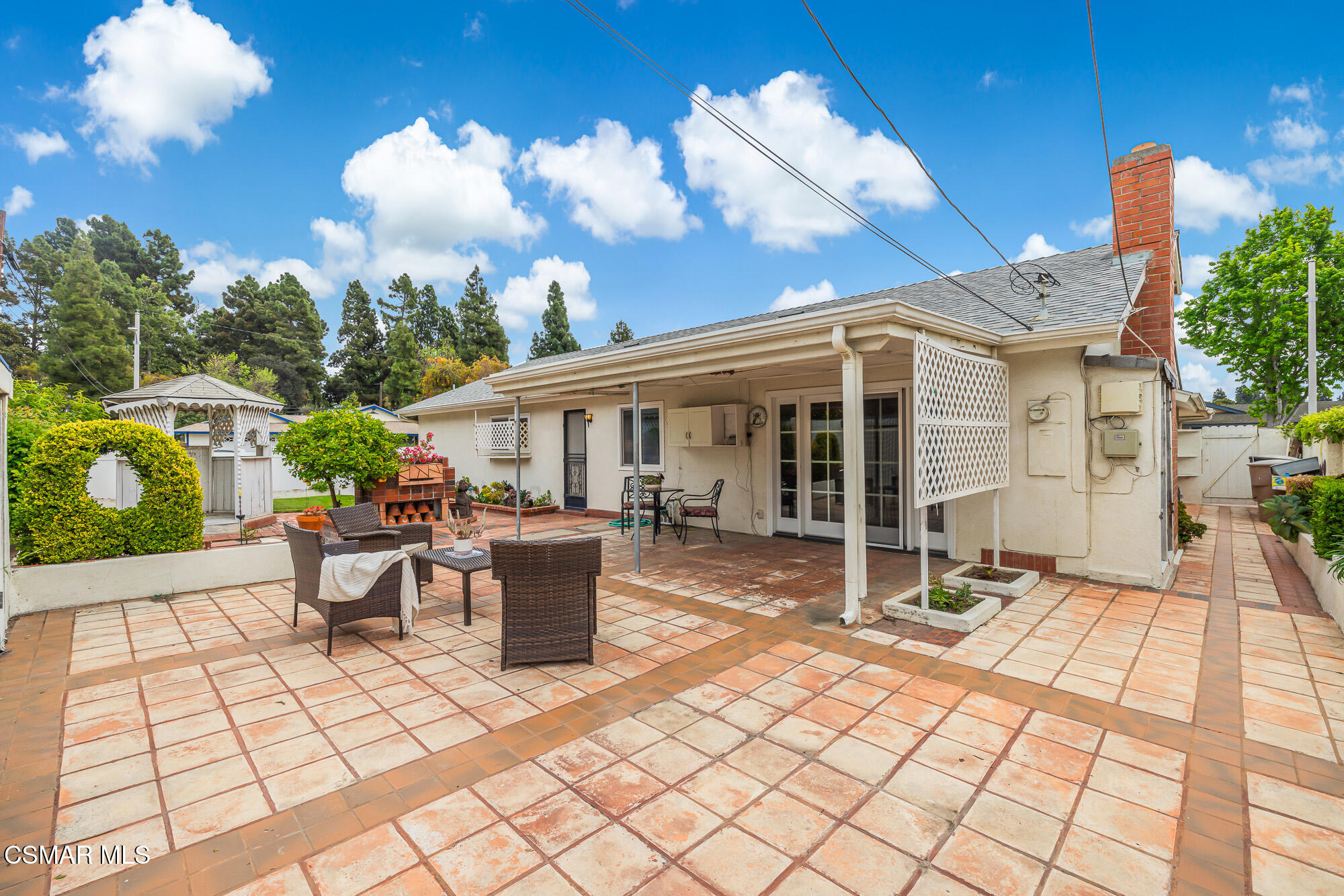 3491 Rivermore Street Camarillo, CA 93010 - Photo 36 of 49 a view of a patio with table and chairs potted plants