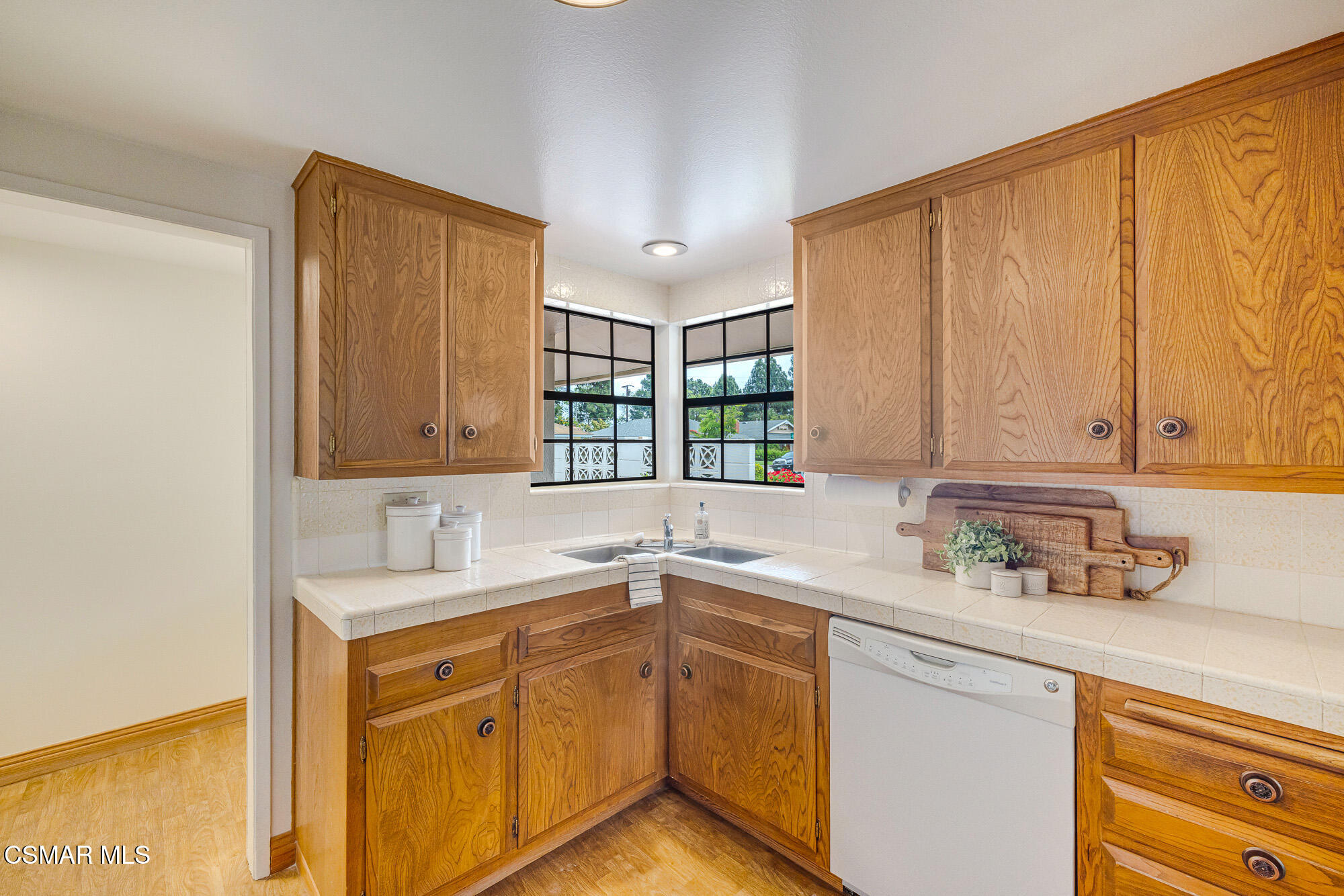 3491 Rivermore Street Camarillo, CA 93010 - Photo 10 of 49 a kitchen with a sink cabinets and window
