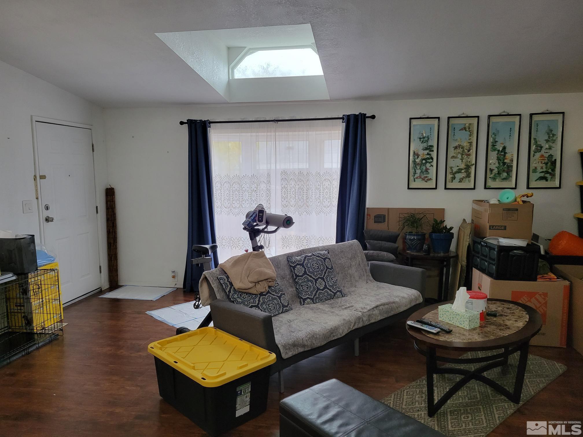 1348 Leopard Street Reno, NV 89506 - Photo 4 of 10 a living room with furniture and a large window