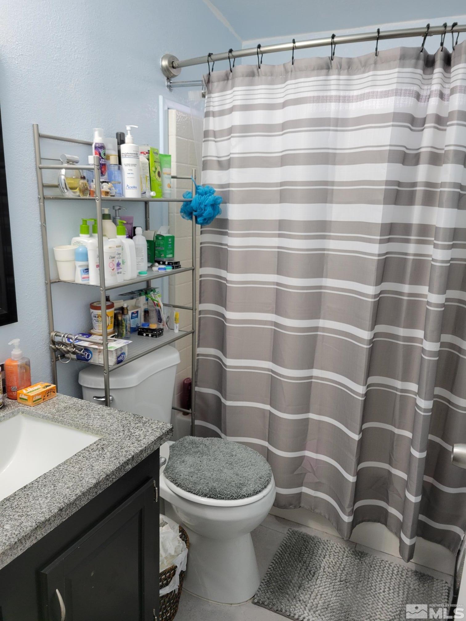 1348 Leopard Street Reno, NV 89506 - Photo 7 of 10 a bathroom with a sink toilet and shower