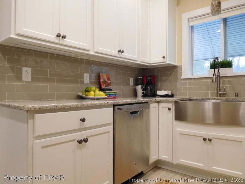 2005 Morganton Road Fayetteville, NC 28305 - Photo 11 of 35 a kitchen with a sink cabinets and window