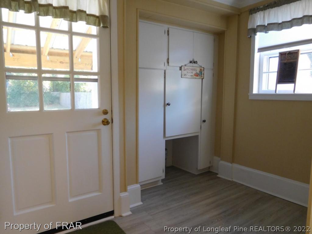 2005 Morganton Road Fayetteville, NC 28305 - Photo 16 of 35 a view of an empty room with wooden floor and a window