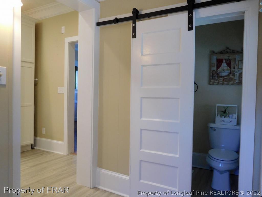 2005 Morganton Road Fayetteville, NC 28305 - Photo 17 of 35 a bathroom with a shower and a toilet