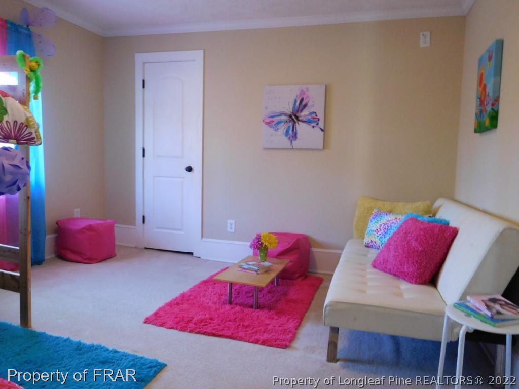 2005 Morganton Road Fayetteville, NC 28305 - Photo 24 of 35 a bedroom with furniture and a couch