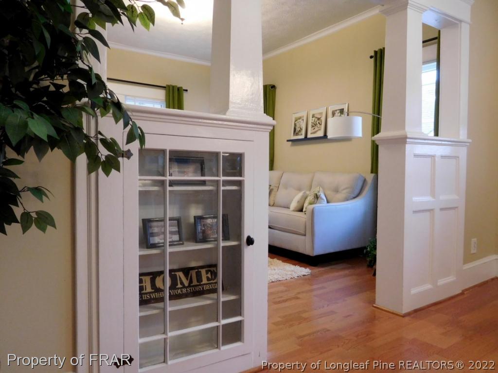 2005 Morganton Road Fayetteville, NC 28305 - Photo 5 of 35 a living room with furniture cabinets and a potted plant