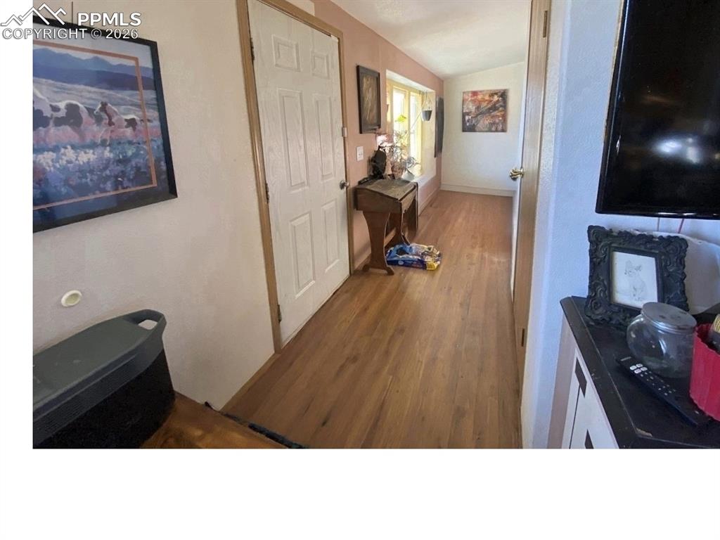 4169 40th Lane Avondale, CO 81022 - Photo 3 of 9 a living room with furniture and a flat screen tv
