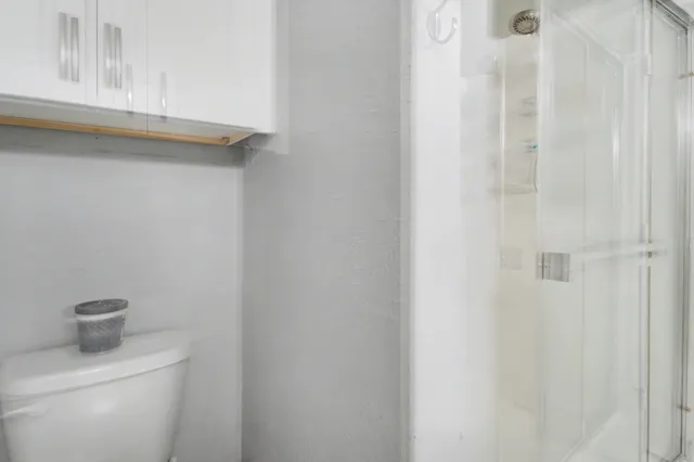 a bathroom with a toilet and a sink