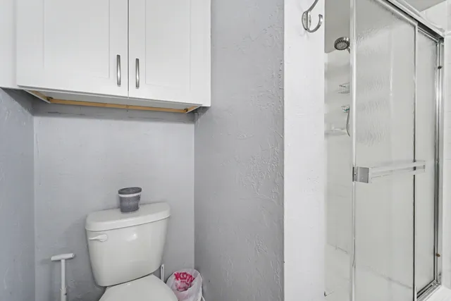a bathroom with a toilet and a sink