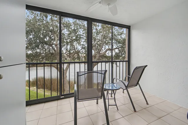 a view of a chairs and table in a room