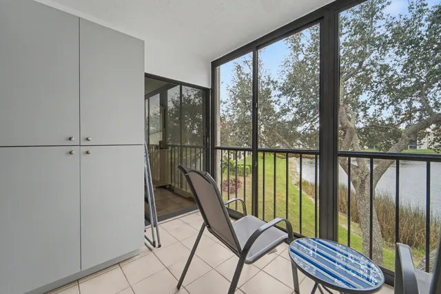 a view of a balcony with chair and table