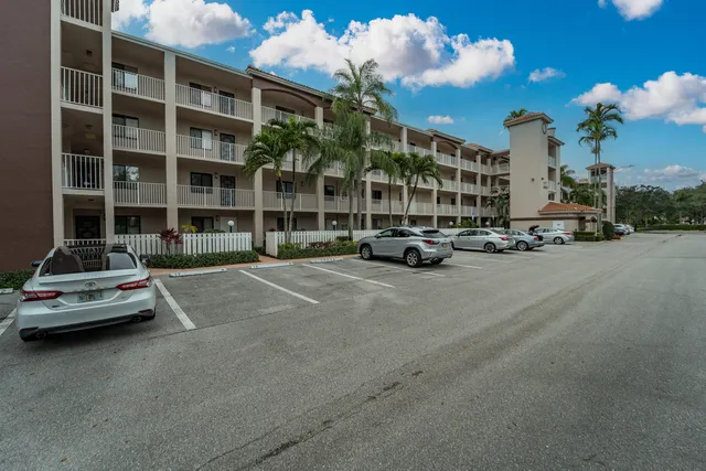 a lobby with furniture and a potted plant