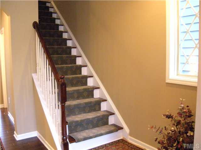 1326 Rodessa Run Raleigh, NC 27607 - Photo 8 of 20 Lovely hardwood tread staircase with custom runner leads to second floor bedrooms and laundry. Staircase