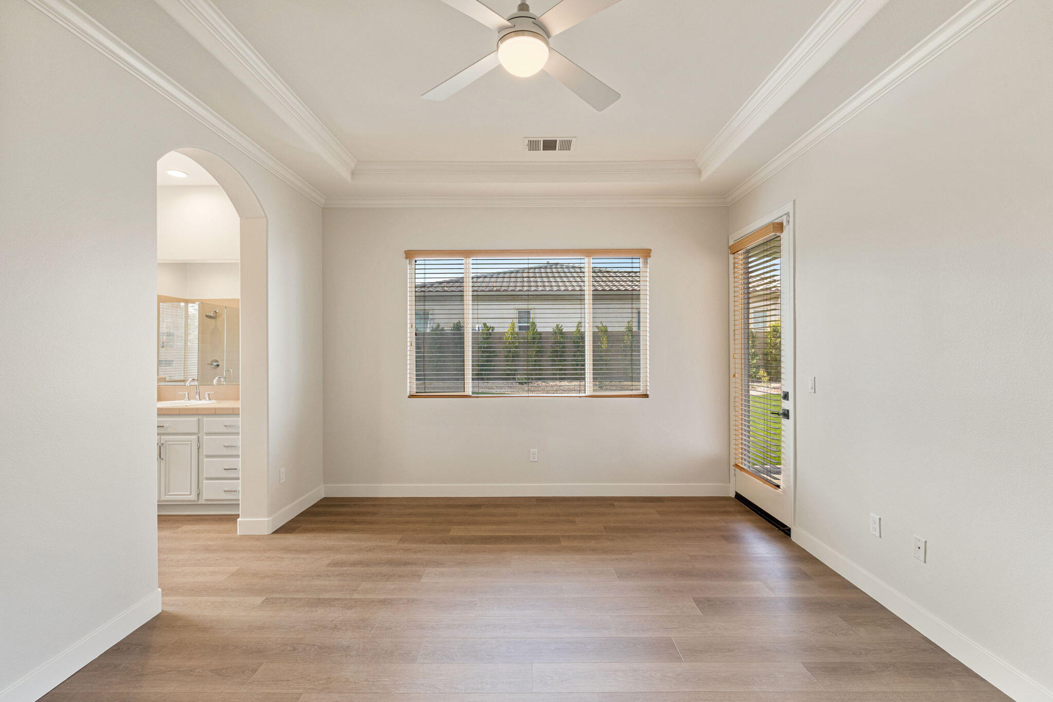 48537 Via Estacio Indio, CA 92201 - Photo 29 of 57 an empty room with wooden floor and windows