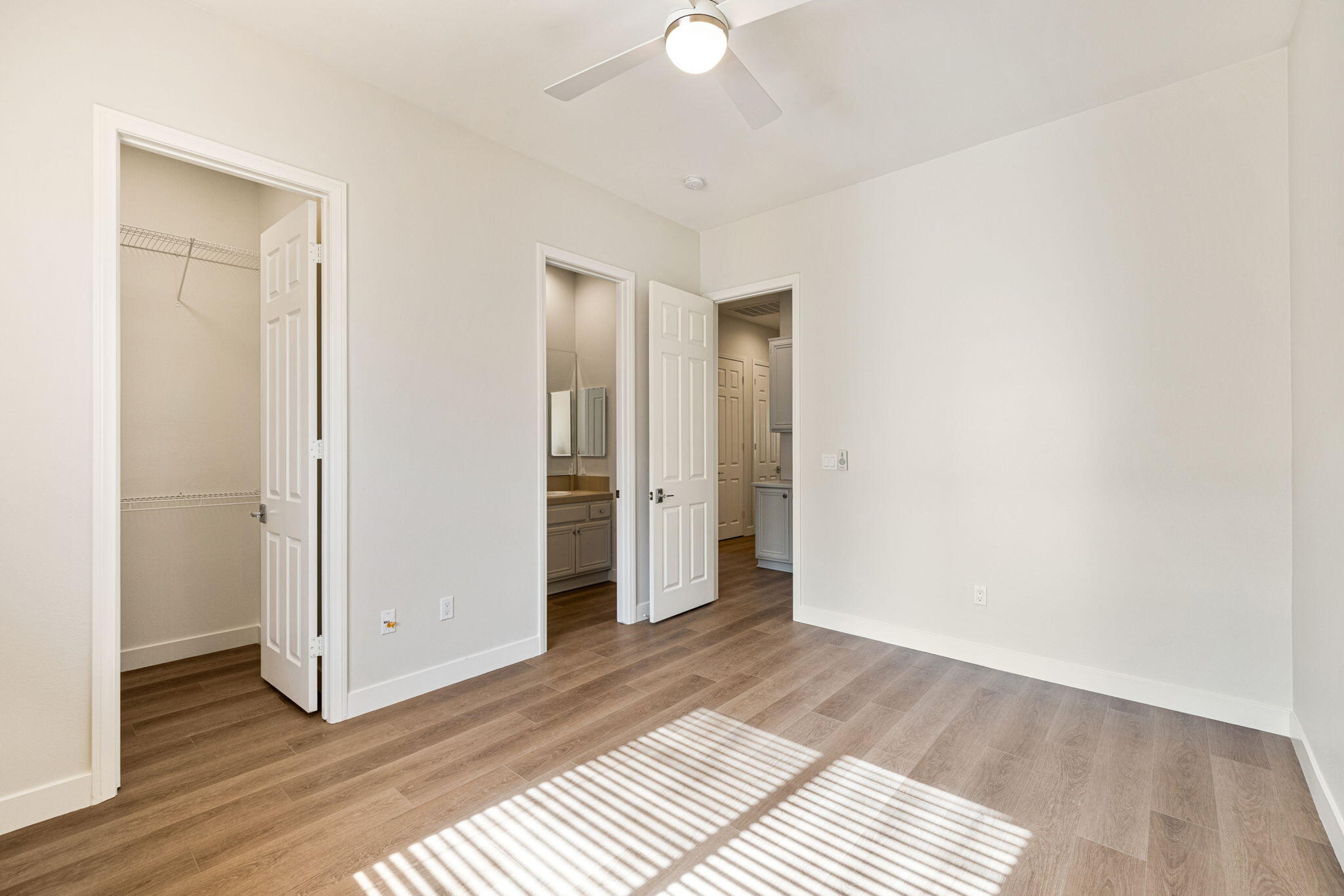 48537 Via Estacio Indio, CA 92201 - Photo 40 of 57 a view of a room with wooden floor and a ceiling fan
