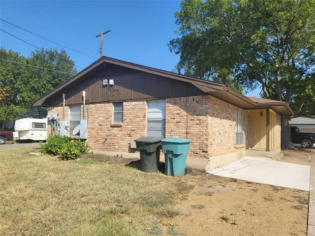 a kitchen with granite countertop a stove and a refrigerator