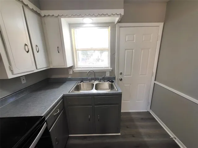 a kitchen with a stove and a refrigerator