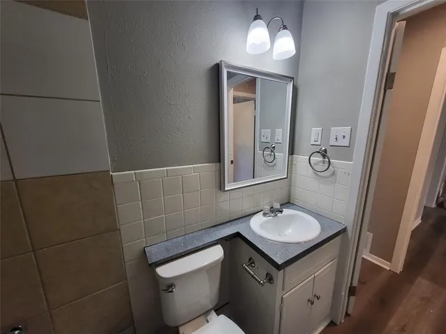 an empty room with a empty space and a ceiling fan