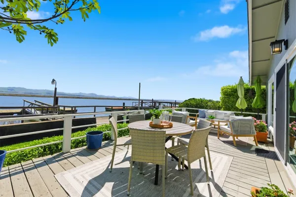 a view of a terrace with furniture and garden
