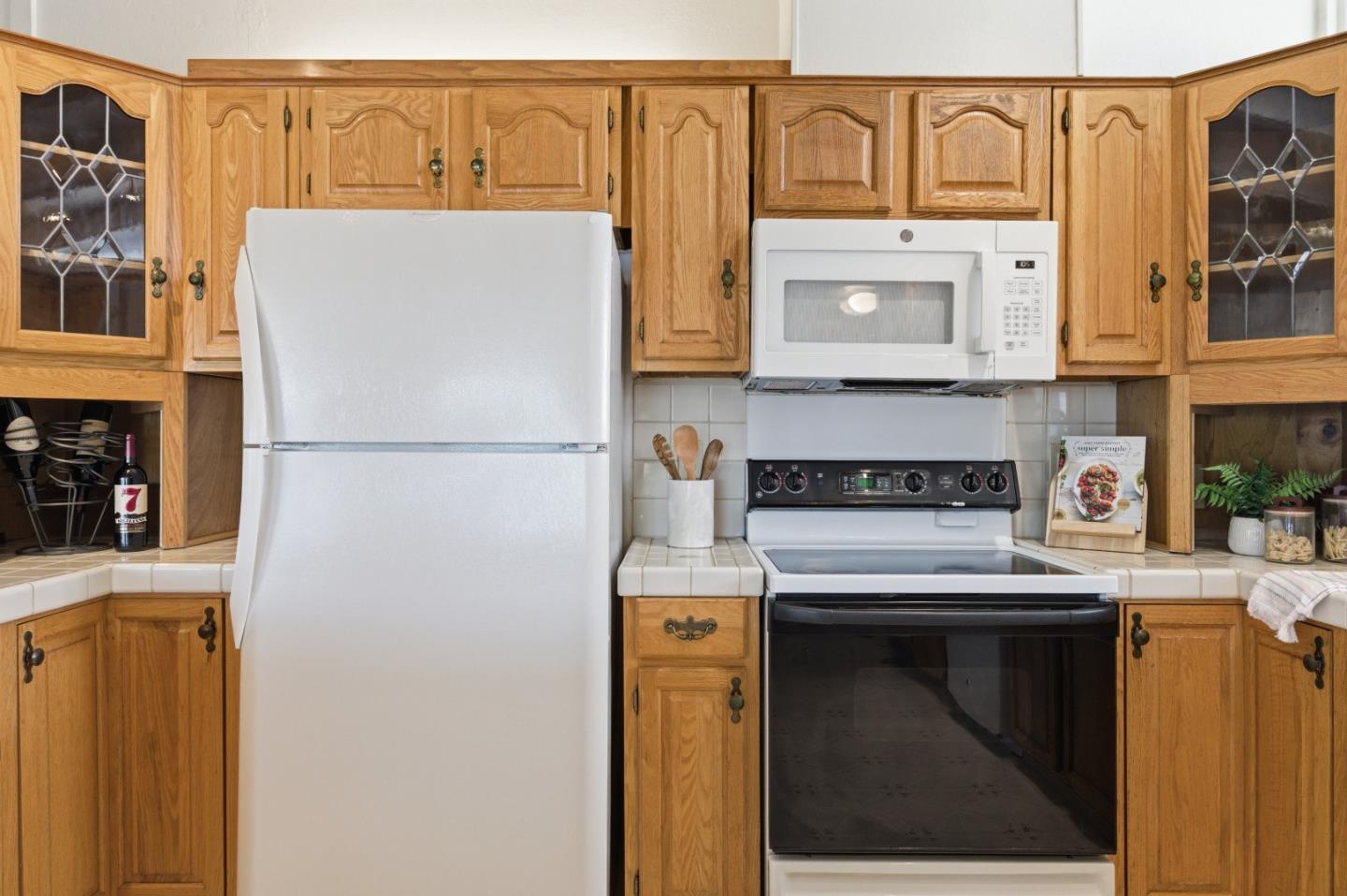 1856 Milton Road Napa, CA 94559 - Photo 16 of 47 a kitchen with stainless steel appliances granite countertop a refrigerator a stove and a sink with cabinets