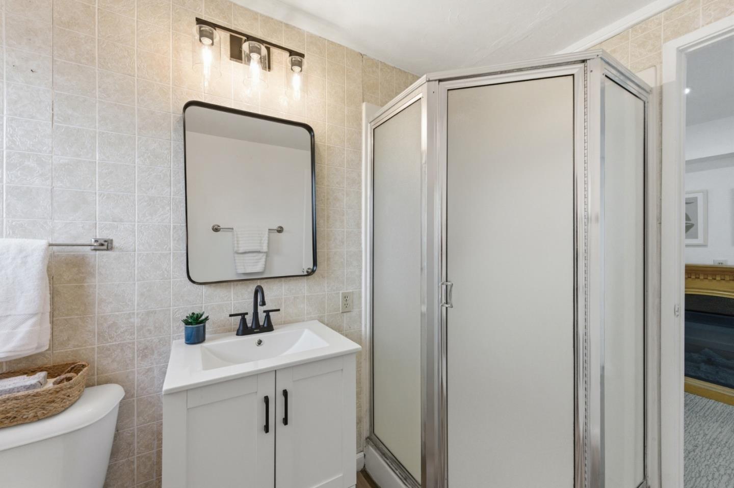 1856 Milton Road Napa, CA 94559 - Photo 38 of 47 a bathroom with a double vanity sink mirror and toilet