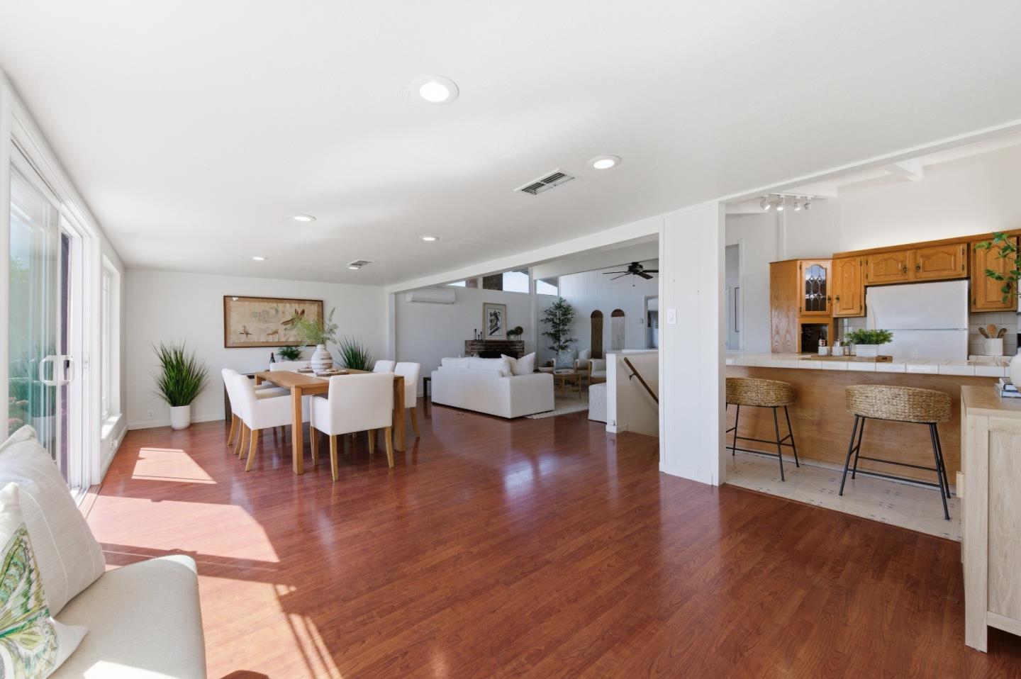 1856 Milton Road Napa, CA 94559 - Photo 9 of 47 a living room with furniture a wooden floor and a large window