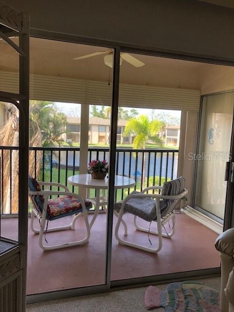 16881 Davis Road, Unit 723 Fort Myers, FL 33908 - Photo 13 of 13 a living room with furniture and a large window