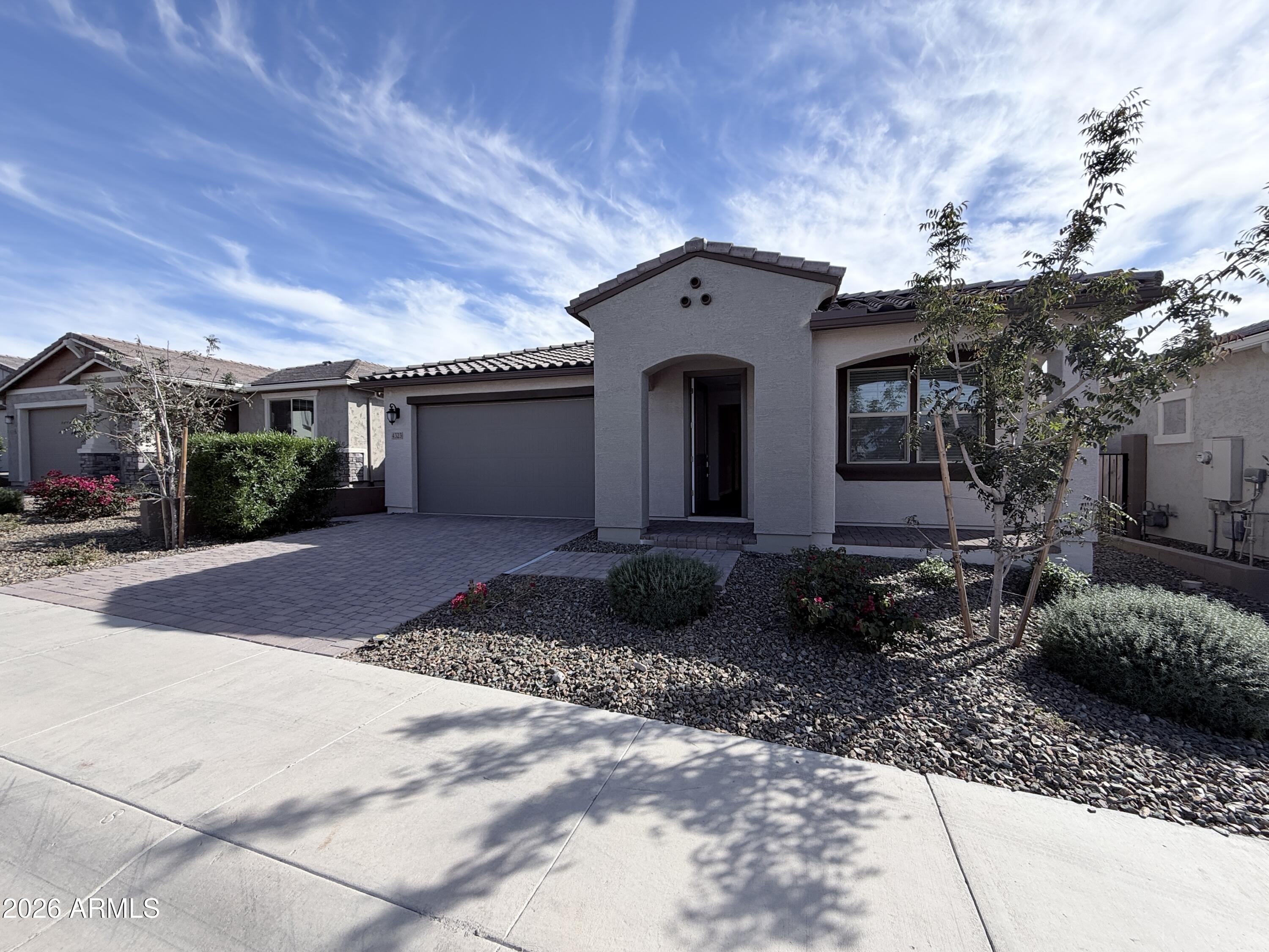 4323 West Palace Sta Road New River, AZ 85087 - Photo 1 of 20 a front view of a house with garden