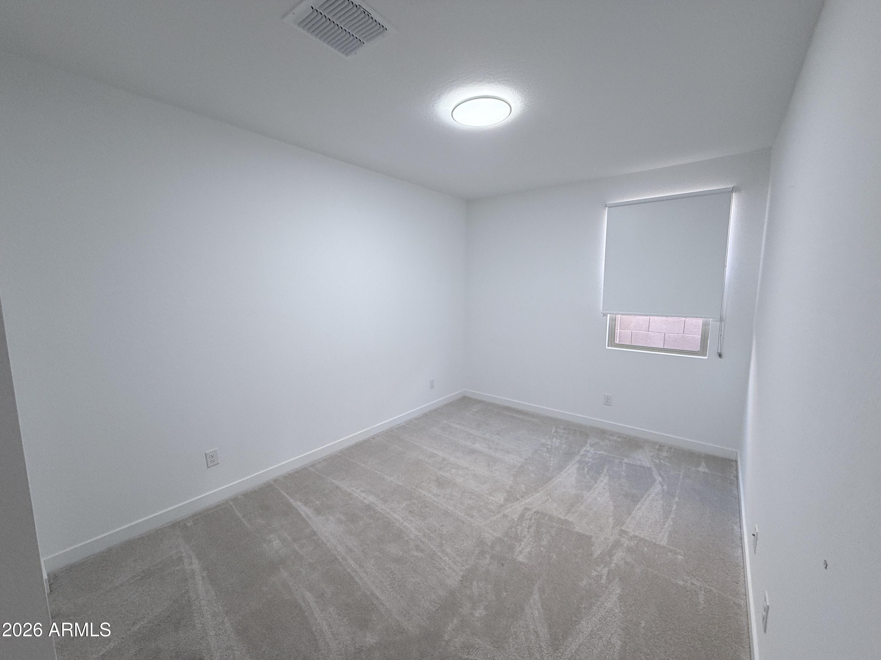 4323 West Palace Sta Road New River, AZ 85087 - Photo 16 of 20 an empty room with a window
