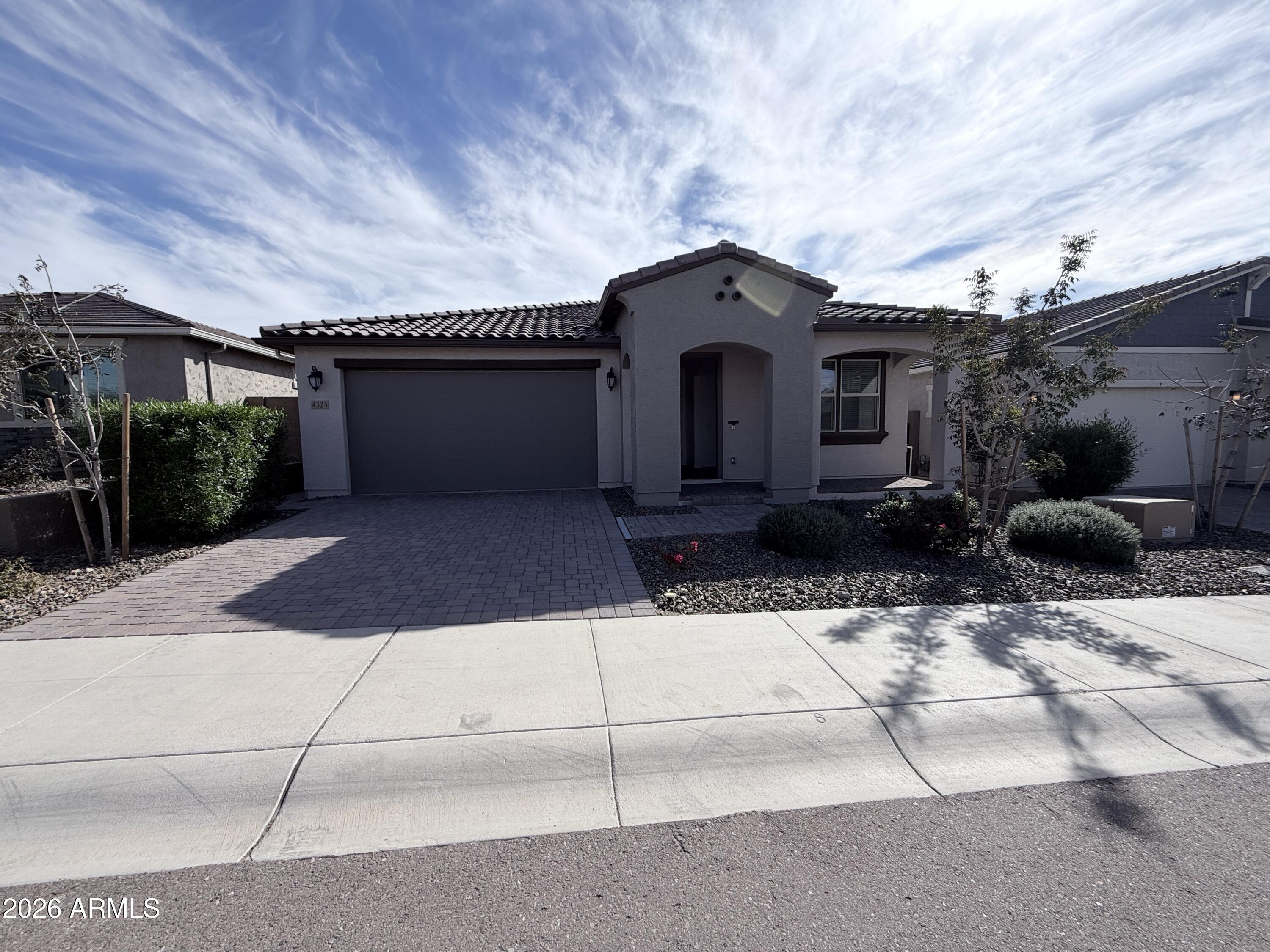 4323 West Palace Sta Road New River, AZ 85087 - Photo 2 of 20 a front view of a house with a yard