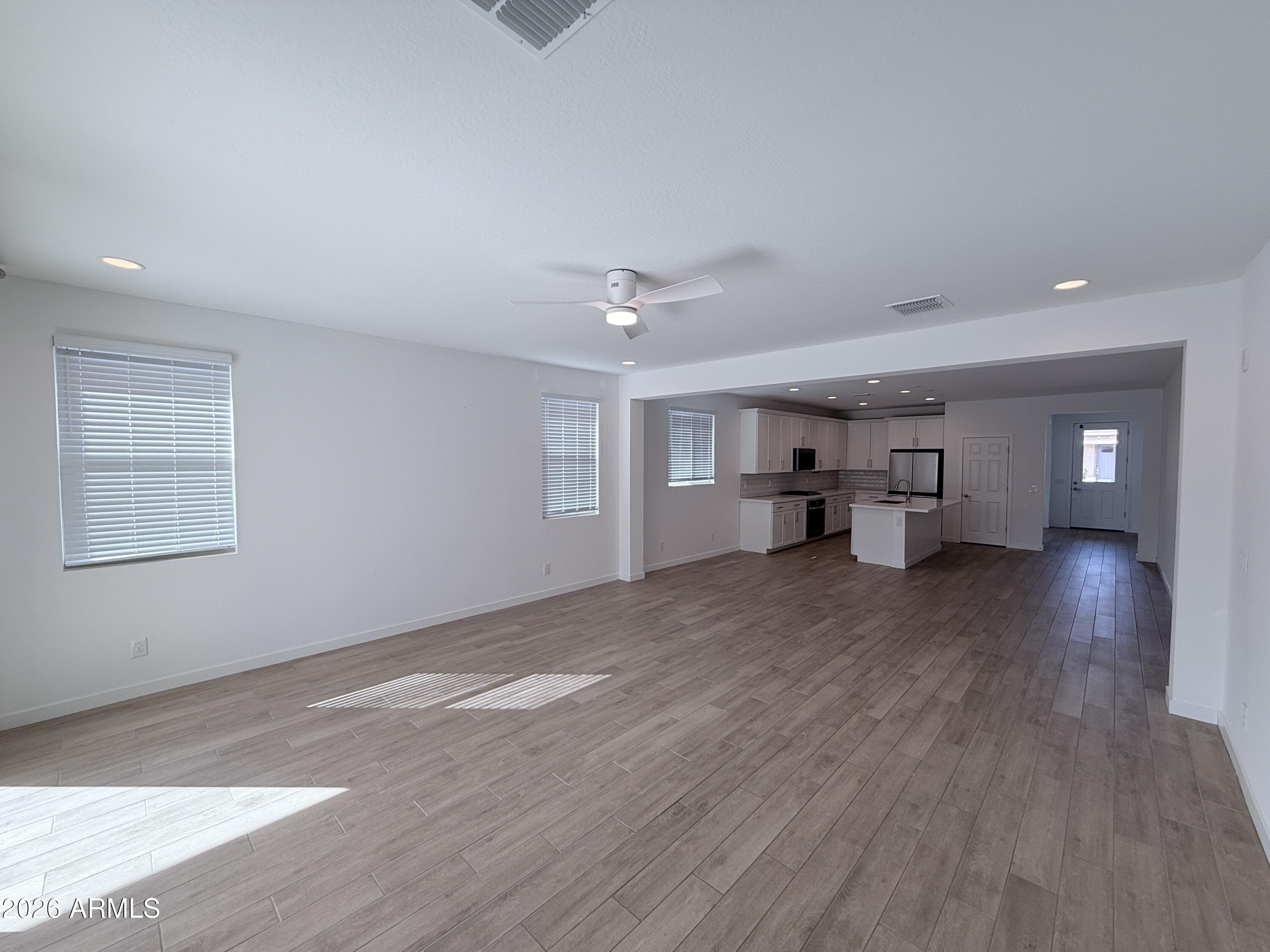 4323 West Palace Sta Road New River, AZ 85087 - Photo 9 of 20 a view of empty room with wooden floor