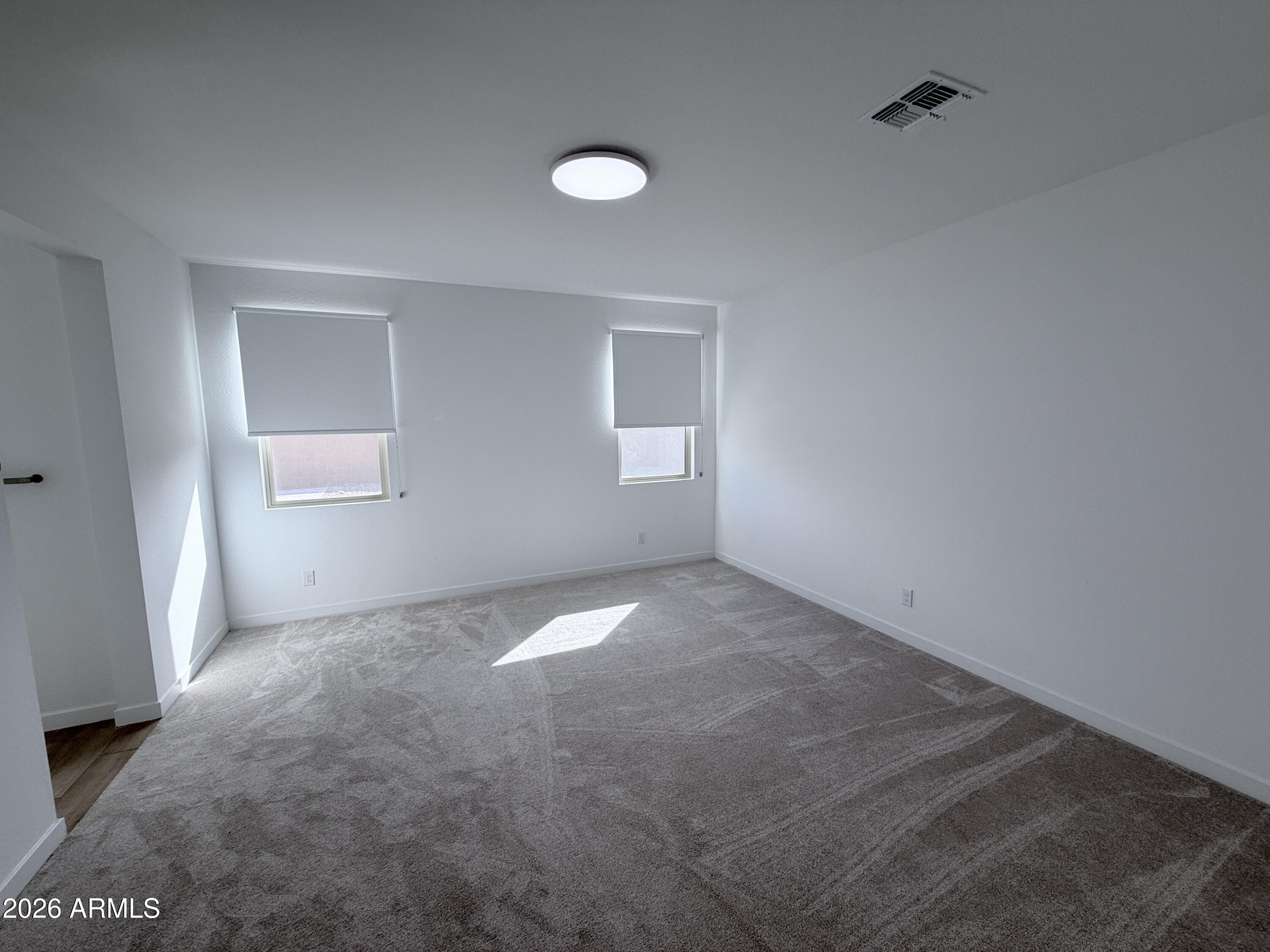 4323 West Palace Sta Road New River, AZ 85087 - Photo 10 of 20 an empty room with windows