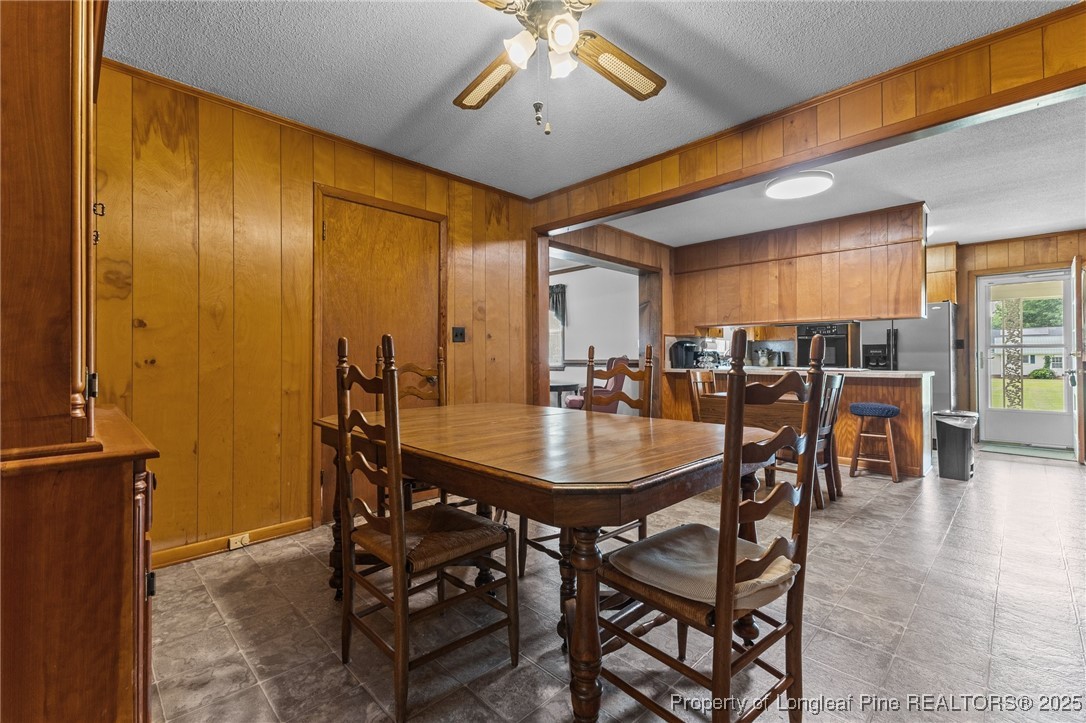 209 4th Street Erwin, NC 28339 - Photo 17 of 43 a dining room with furniture and window