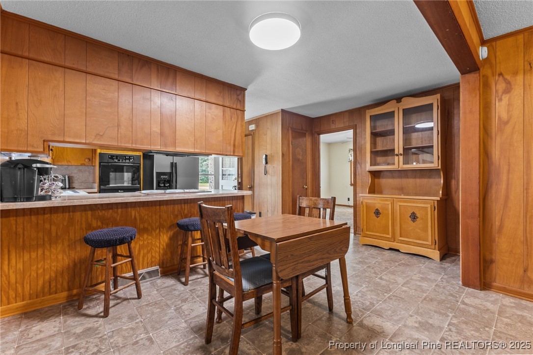 209 4th Street Erwin, NC 28339 - Photo 18 of 43 a dining room with furniture and window