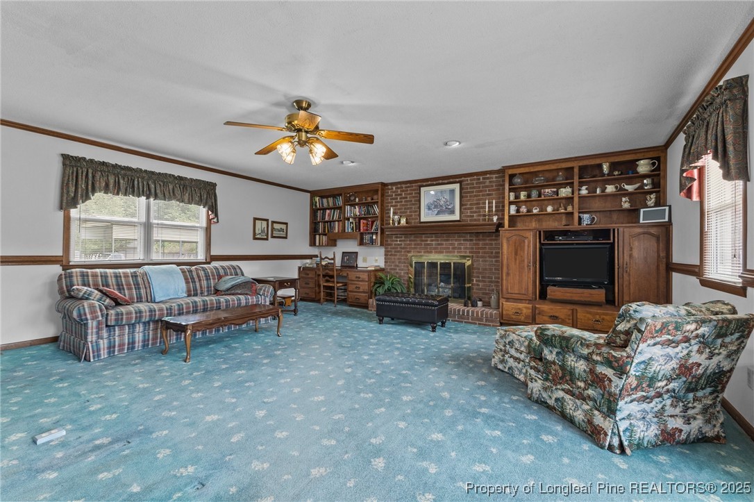 209 4th Street Erwin, NC 28339 - Photo 24 of 43 a living room with furniture and a fireplace