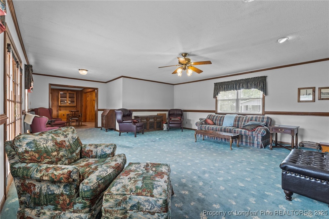 209 4th Street Erwin, NC 28339 - Photo 25 of 43 a living room with furniture and a window