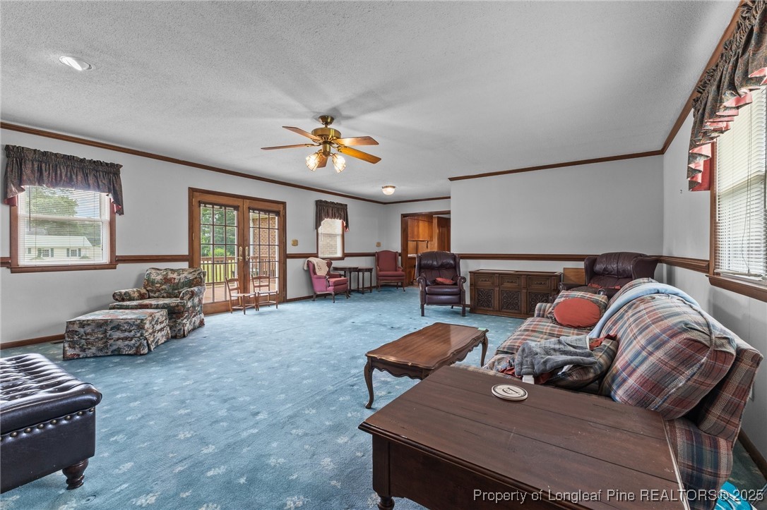 209 4th Street Erwin, NC 28339 - Photo 27 of 43 a living room with furniture fireplace and a window