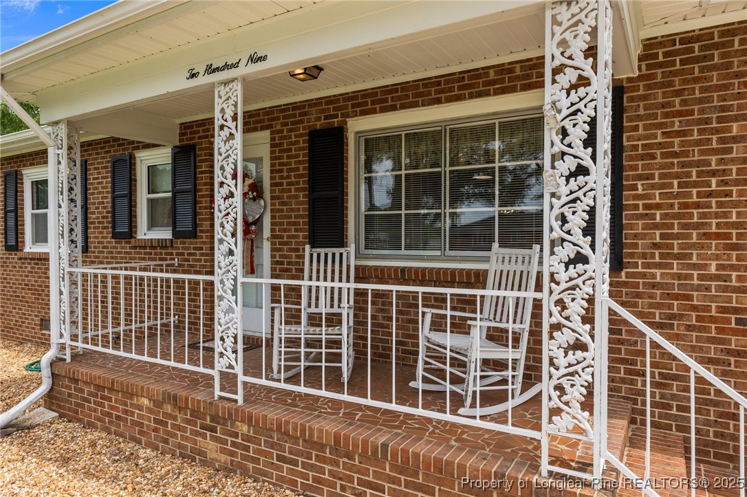 209 4th Street Erwin, NC 28339 - Photo 3 of 43 a view of a balcony with a window