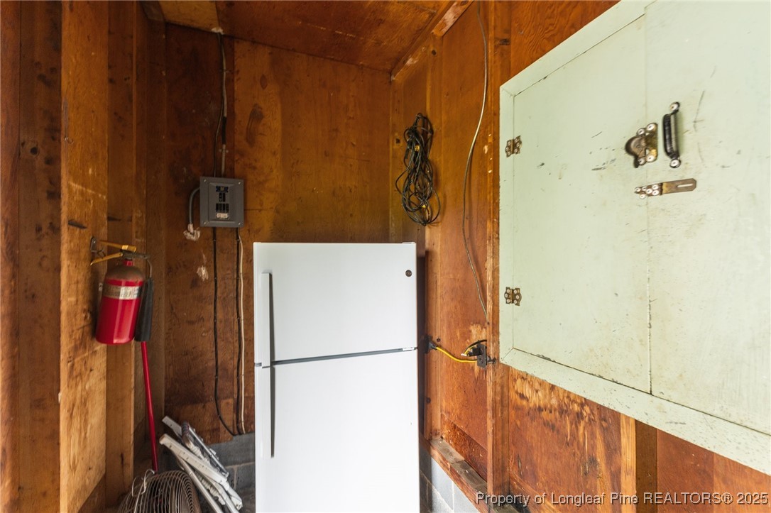 209 4th Street Erwin, NC 28339 - Photo 31 of 43 a white refrigerator freezer and a stove sitting inside of a kitchen