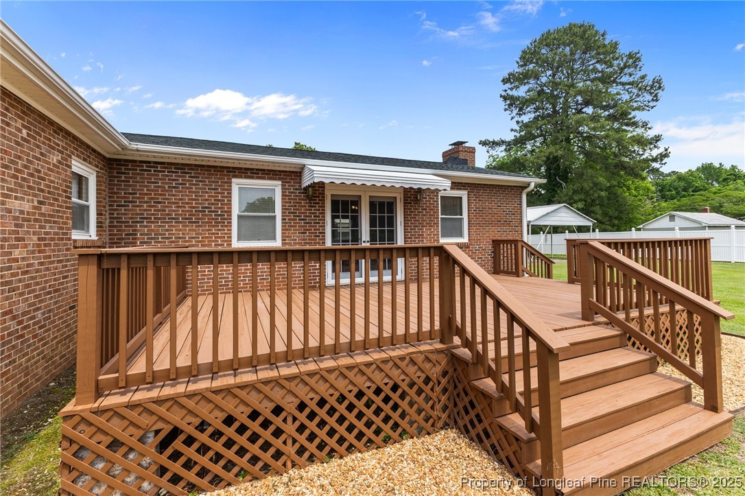 209 4th Street Erwin, NC 28339 - Photo 32 of 43 a view of a house with wooden fence