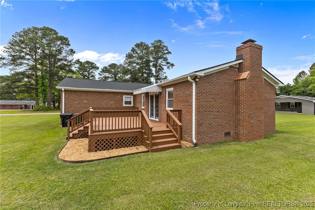 209 4th Street Erwin, NC 28339 - Photo 33 of 43 a front view of a house with garden