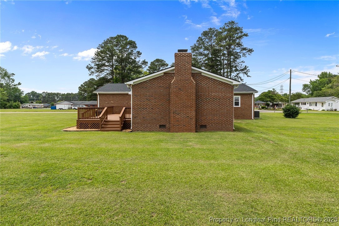 209 4th Street Erwin, NC 28339 - Photo 34 of 43 a view of a house with backyard and garden